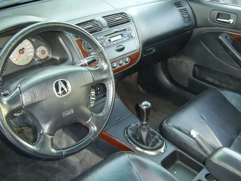 Фото Acura EL (2003) — интерьер, фото 5. Салон целиком: как расставлены кресла и что под рукой у водителя Acura EL (2003) — интерьер, фото 5