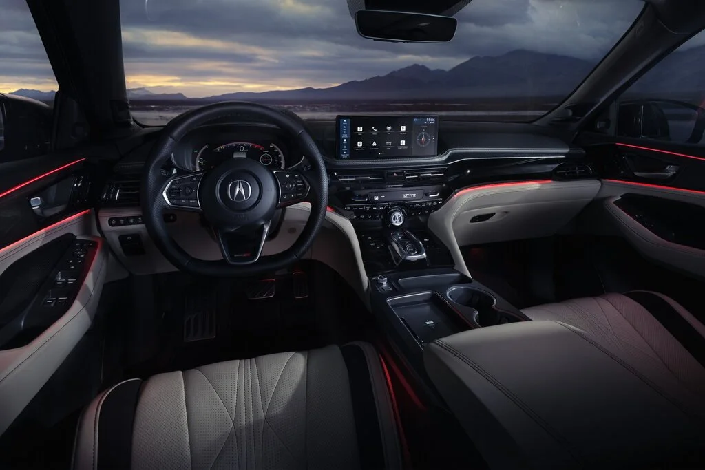 Фото Acura MDX (2024) — интерьер. Общий план салона: панель, консоль и передние кресла Acura MDX (2024) — интерьер
