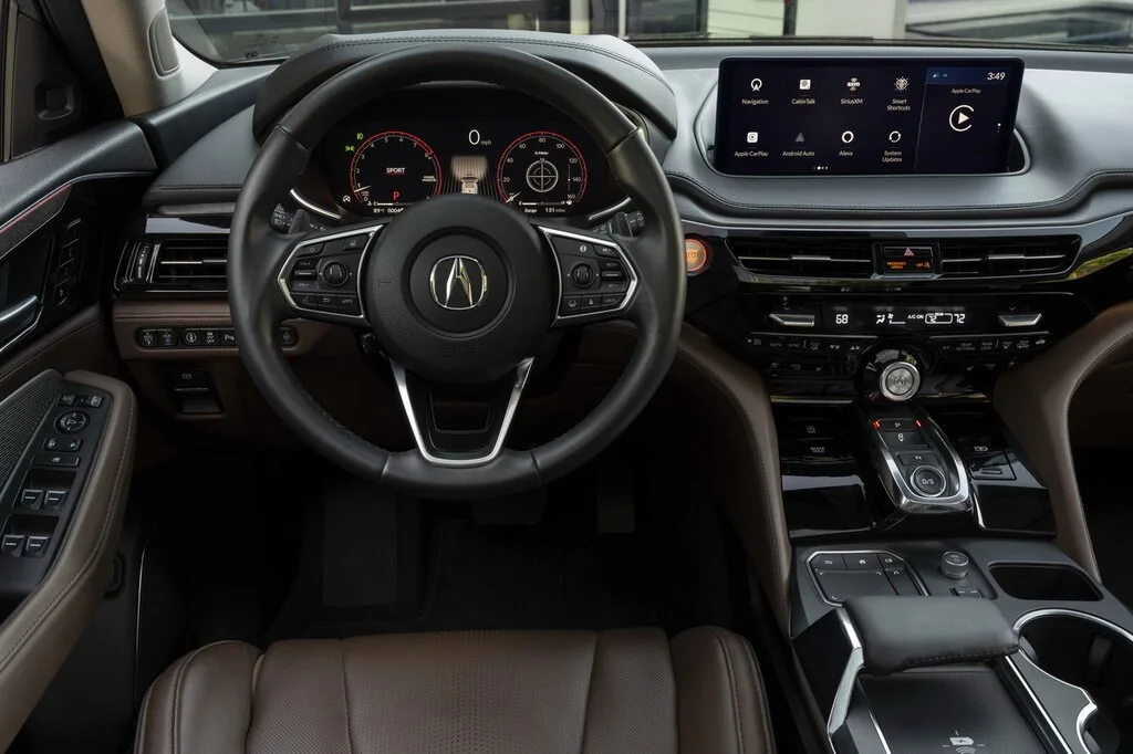 Фото Acura MDX (2024) — интерьер, фото 7. Общий план салона: панель, консоль и передние кресла Acura MDX (2024) — интерьер, фото 7