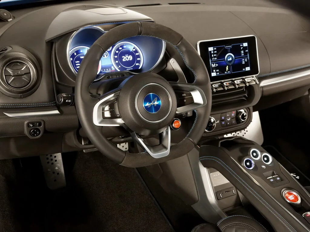 Фото Alpine A110 (2024) — интерьер. Общий план салона: панель, консоль и передние кресла Alpine A110 (2024) — интерьер