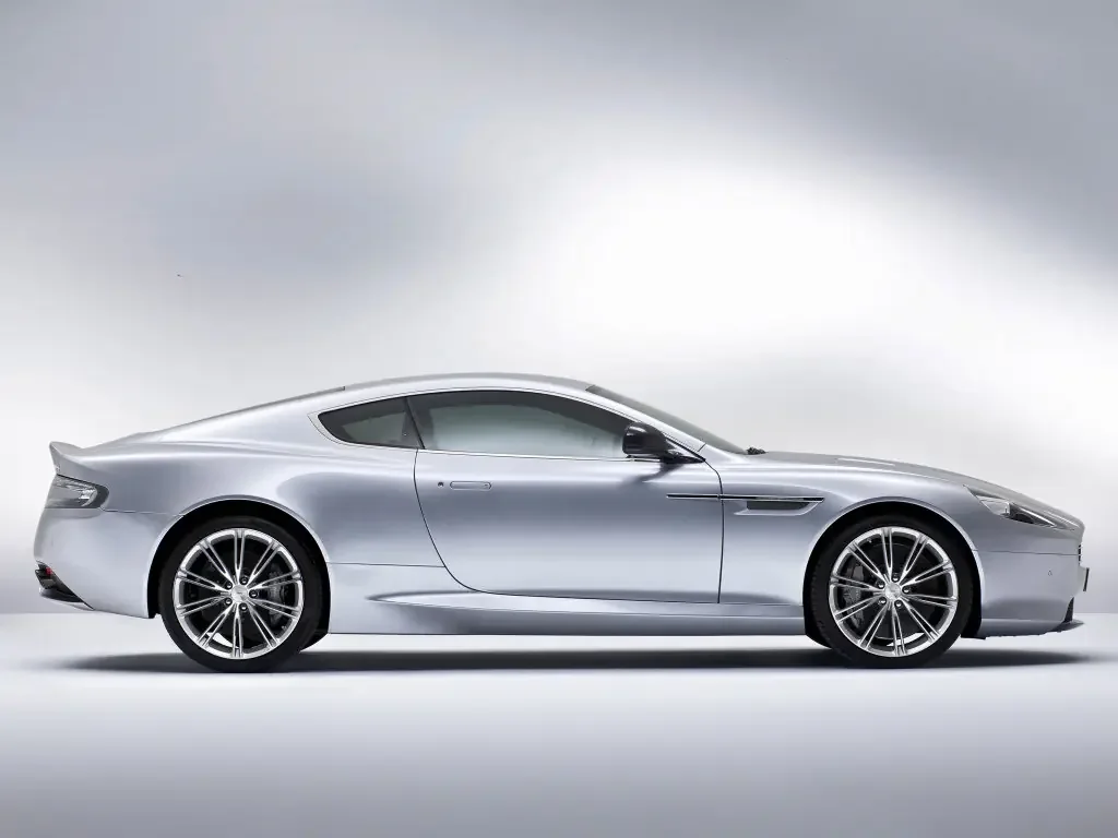 Фото Aston Martin DB9 (2016) — вид сбоку, фото 2. Вид сбоку целиком: колёсная база и размер арок Aston Martin DB9 (2016) — вид сбоку, фото 2