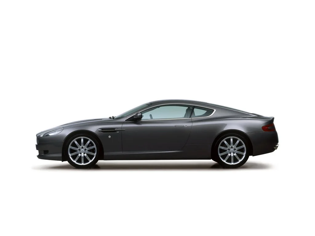 Фото Aston Martin DB9 (2016) — вид сбоку, фото 4. Профиль: длина кузова, линия крыши и посадка на колёсах Aston Martin DB9 (2016) — вид сбоку, фото 4