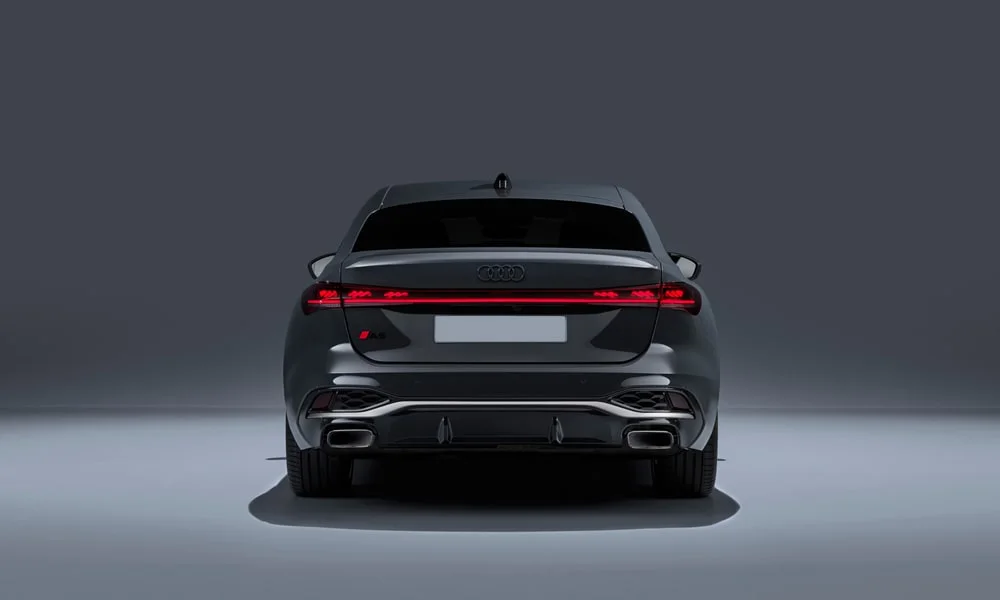 Фото Audi A5 Sportback — вид сзади, фото 8. Линия крыши, стойки и задняя дверь в сером исполнении. Насадки выхлопа или их имитация внизу бампера различают версии Audi A5 Sportback — вид сзади, фото 8