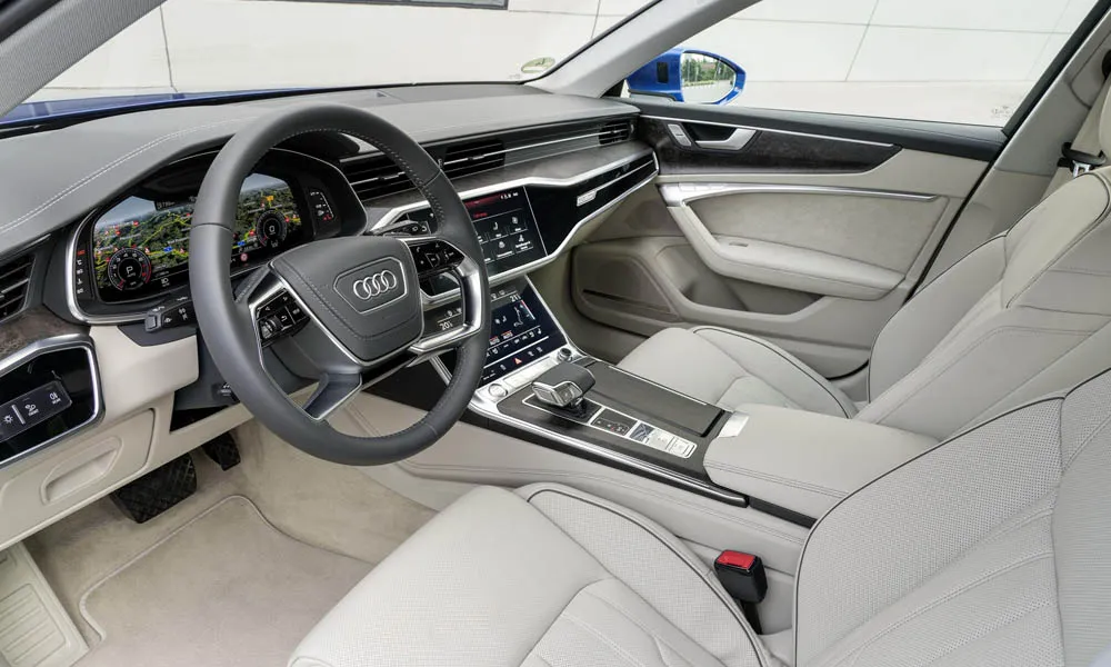 Фото Audi A6 Avant — передняя панель, фото 3. Передняя панель в тёмно-синей отделке: расположение экранов и дефлекторов. Минимум физических кнопок — ставка на экранное управление Audi A6 Avant — передняя панель, фото 3