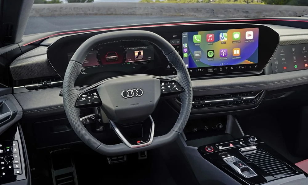 Фото Audi S6 Avant e-tron (2024) — экран мультимедиа. Интерфейс медиасистемы крупным планом. Климат и обогревы часто управляются с этого экрана — привыкание занимает пару дней Audi S6 Avant e-tron (2024) — экран мультимедиа