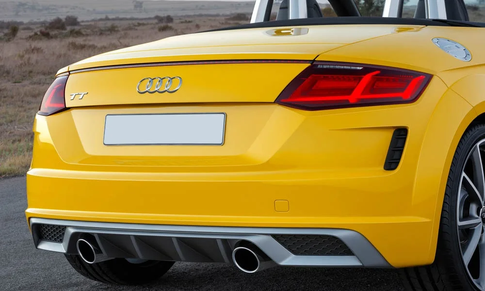 Фото Audi TT — вид сзади, фото 15. Графика фонарей, бампер и оформление пятой двери. Насадки выхлопа или их имитация внизу бампера различают версии Audi TT — вид сзади, фото 15