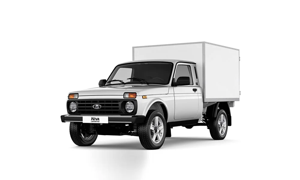 Фото LADA Niva Legend Фургон — вид спереди, фото 4. Кузов в белом цвете: рисунок оптики и решётки задаёт узнаваемое «лицо» модели. Дневные ходовые огни включаются автоматически с запуском LADA Niva Legend Фургон — вид спереди, фото 4