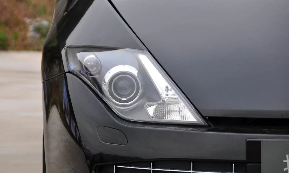 Фото Renault Laguna — передняя оптика, фото 2. Начинка фары: модули ближнего и дальнего света, ходовые огни Renault Laguna — передняя оптика, фото 2
