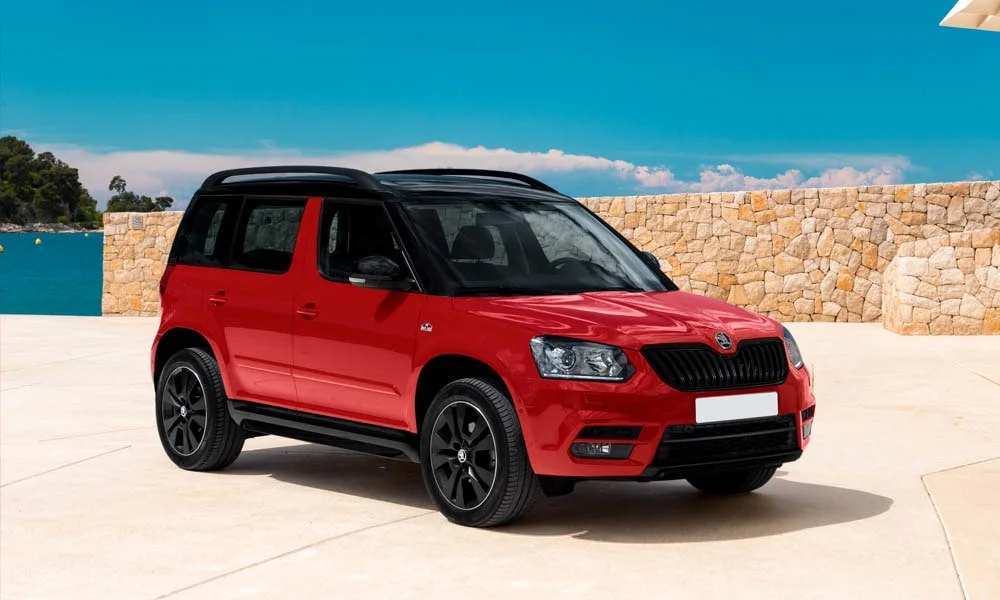 Фото Skoda Yeti — вид спереди, фото 9. Передок в красном исполнении — крупная светотехника и выразительный бампер Skoda Yeti — вид спереди, фото 9