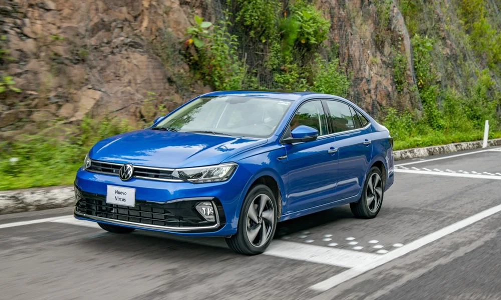 Фото Volkswagen Virtus (2024) — вид спереди, фото 4. Оптика, решётка и бампер — первое впечатление о модели. Дневные ходовые огни включаются автоматически с запуском Volkswagen Virtus (2024) — вид спереди, фото 4